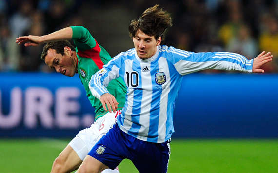 Closely guarded. Lionel Messi skips away from his marker as Argentina defeat Mexico 3-1 (Getty Images)
