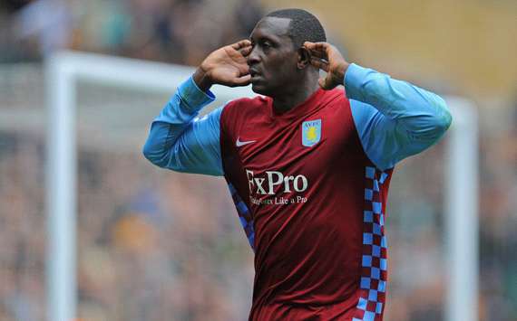 Aston Villa's Emile Heskey listens to the crowd noise as he snatches a late winner at Wolverhampton (Getty Images)