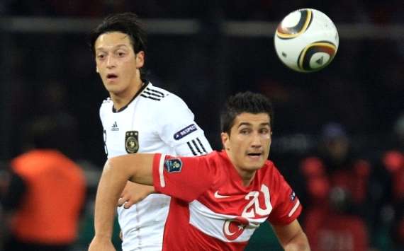 Germany star Mesut Oezil watches on as Turkey's Nuri Sahin peels away after the ball (Getty Images)