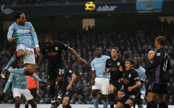 Joleon Lescott towers above Aston Villa's defenders to head Manchester City towards a 4-0 win (Getty Images)