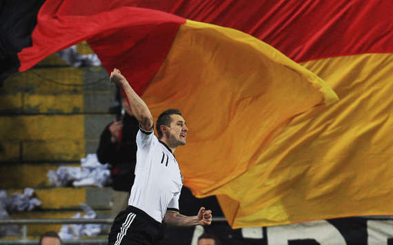 Miroslav Klose Celebrates In Front Of A Germany Flag