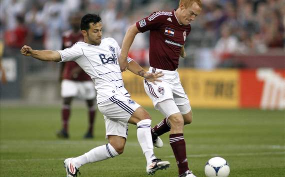 Davide Chiumiento, Vancouver Whitecaps; Jeff Larentowicz, Colorado Rapids; MLS