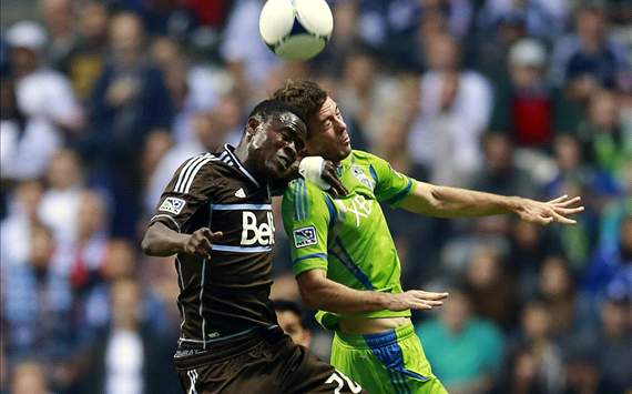Gershon Koffie #28 of the Vancouver Whitecaps FC and Brad Evans #3 of the Seattle Sounders FC compete for the ball