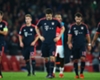 Bayern Munich players trudge off at the Emirates Stadium