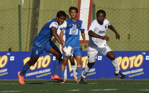 United Sikkim captain Anwar Ali tries to stop Dempo's Koko Sakibo, I-League