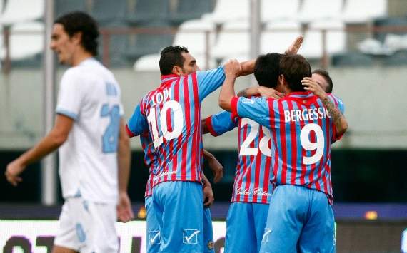 Catania players celebrate a goal against Lazio