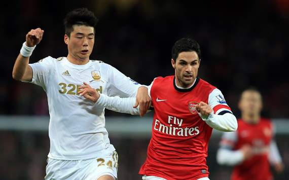 EPL -Arsenal v Swansea City, Mikel Arteta and Ki Sung-Yong