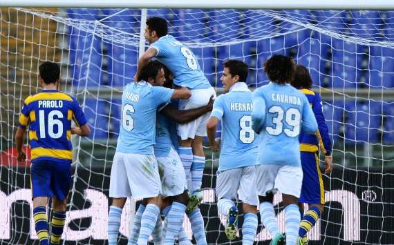 Lazio players celebrate a goal against Parma