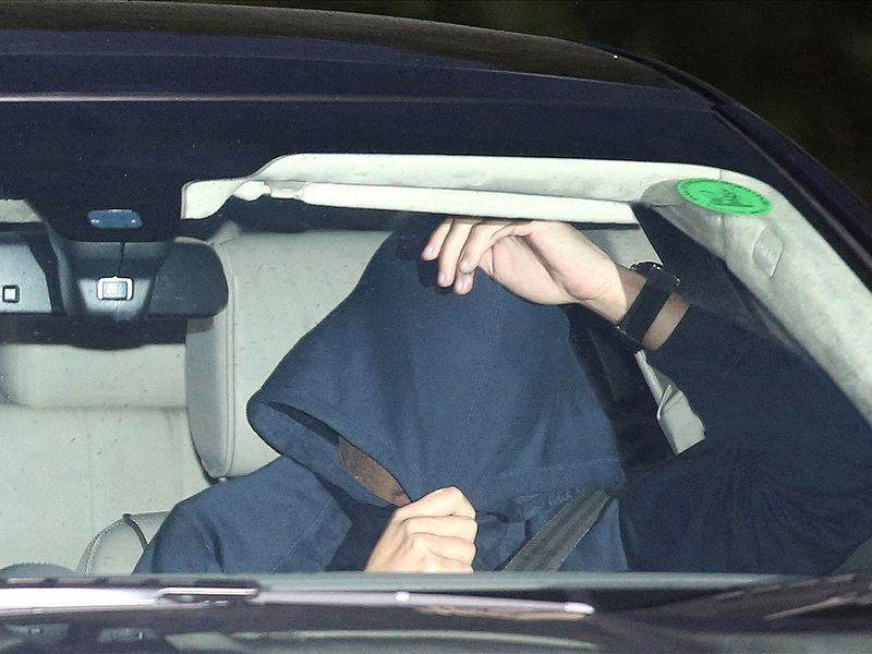 Mourinho NOT the hooded man pictured leaving Chelsea's training ground