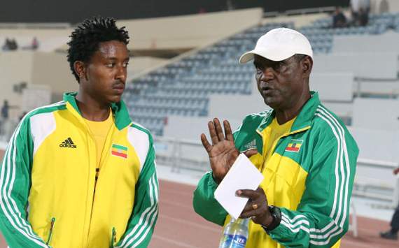 Ethiopia's Alula Girma listens to Sewnet Bishaw, coach of Ethiopia