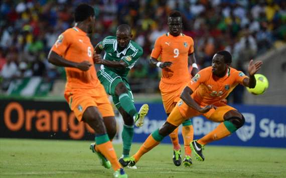 Sunday Mba of Nigeria scoring a goal against Ivory Coast