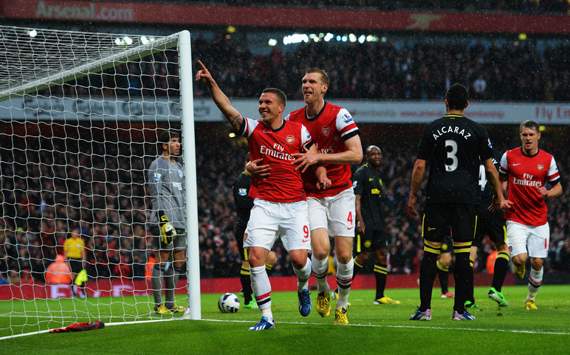 EPL - Arsenal v Wigan Athletic, Lukas Podolski and Per Mertesacker