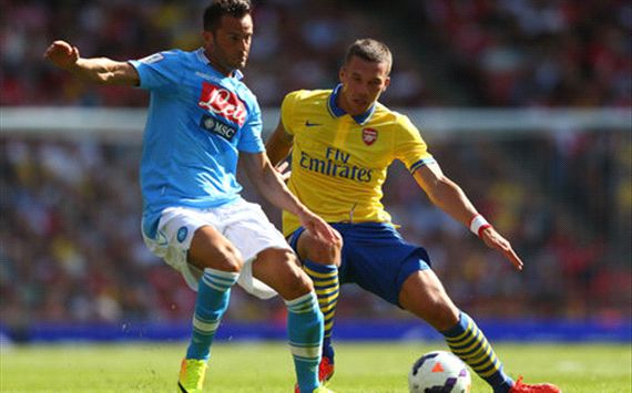 Giandomenico Mesto and Lukas Podolski in Arsenal v Napoli Emirates Cup clash