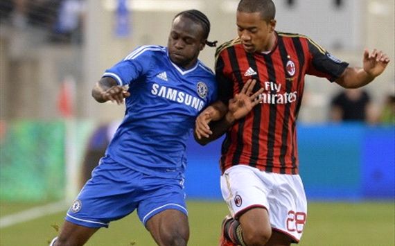 Victor Moses vies for the ball with Urby Emanuelson