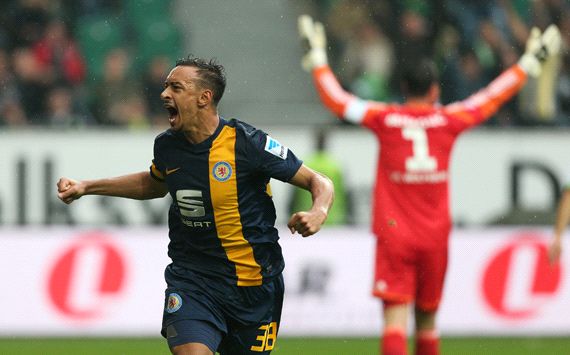 Braunschweig's Karim Bellarabi celebrates his goal against Wolfsburg