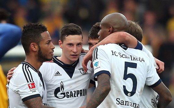 Players of Schalke celebrate after the match against Braunschweig