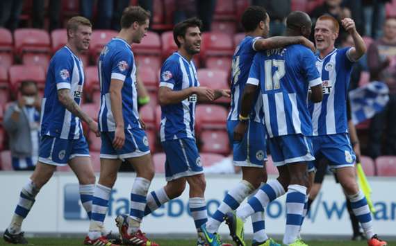 Wigan Athletic players celebrate scoring a goal