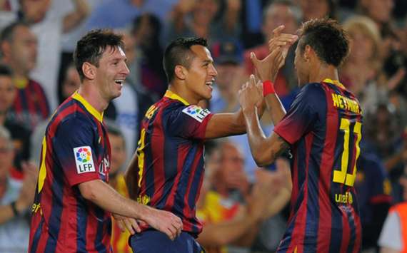 Barcelona players celebrate a goal against Real Madrid