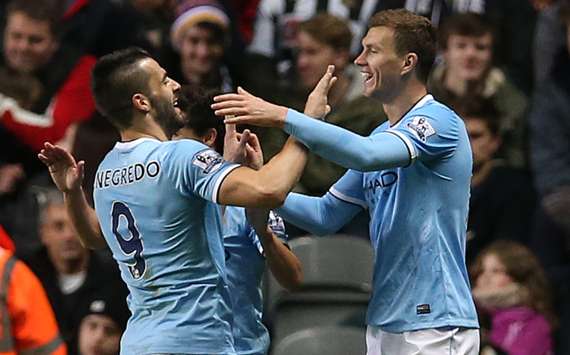 Alvaro Negredo and Edin Dzeko celebrate a goal