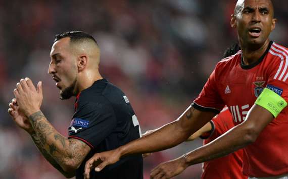 Olympiacos' Kostas Mitroglu and Luisao of Benfica
