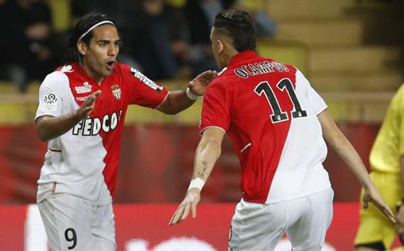 Monaco striker Radamel Falcao celebrates his equaliser against Evian