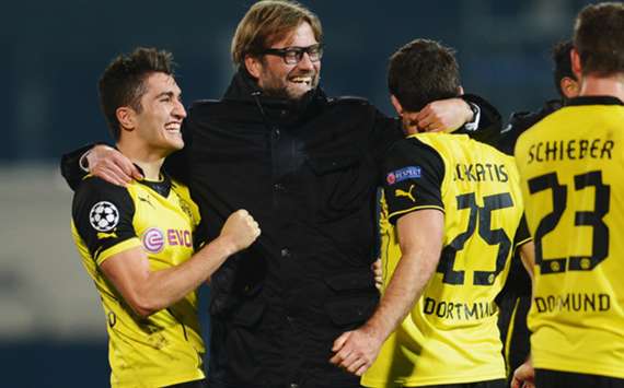 Borussia Dortmund coach Jurgen Klopp celebrates with his players