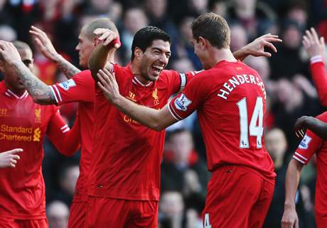 Suarez sends Liverpool top