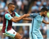 Winston Reid and Sergio Aguero contend for possession Winston Reid and Sergio Aguero contend for possession