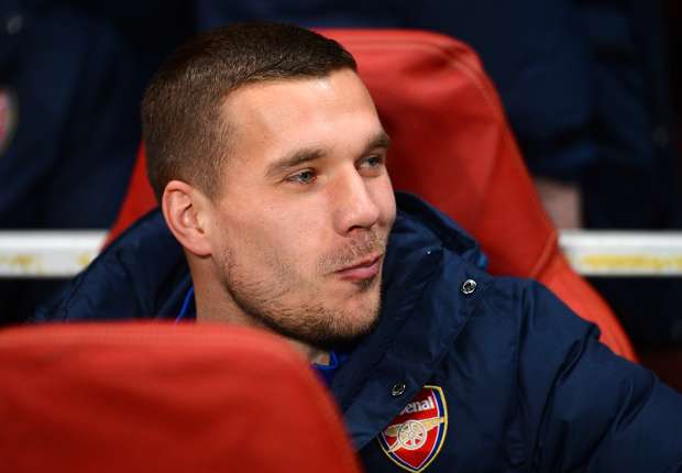 Podolski happy to stay at Arsenal