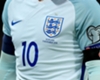 Wayne Rooney wears an armband featuring a poppy