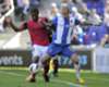 Elisue (L) in action for Malaga Elisue (L) in action for Malaga