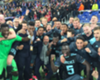 Peter Bosz celebrates with his Ajax players after their aggregate victory over Lyon