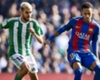 Dani Ceballos of Real Betis playing against Barcelona's Neymar Dani Ceballos of Real Betis playing against Barcelona's Neymar