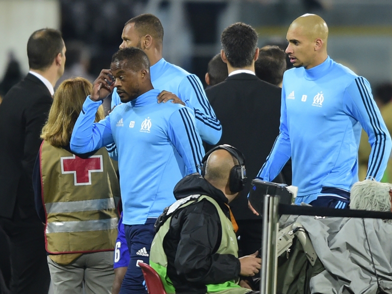 Evra shown red card for kicking fan as violence erupts before Marseille match
