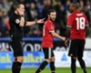Referee Kevin Friend (L) rules out Juan Mata's goal against Huddersfield Town