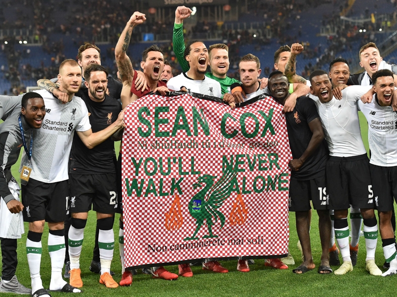 Liverpool players honour stricken fan Sean Cox with banner after Roma win
