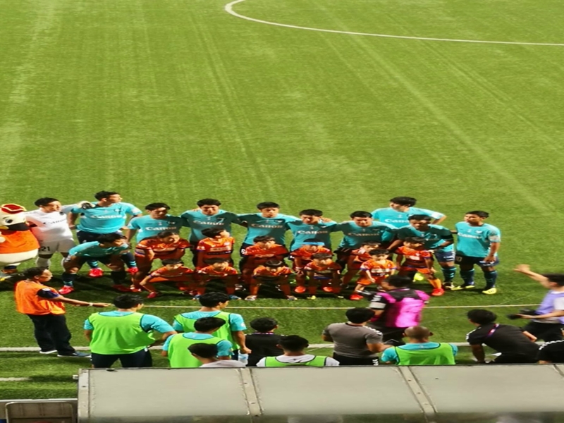 Albirex Niigata players perform dance with their fans after winning the Singapore Cup