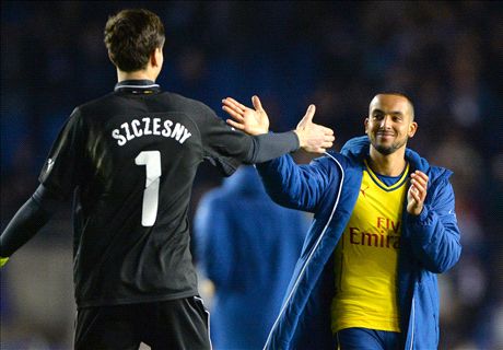 Ozil & Walcott score in narrow win