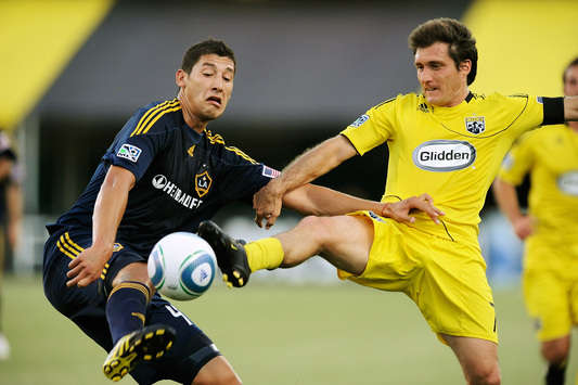 Omar Gonzalez, Los Angeles Galaxy; Guillermo Barros Schelotto, Columbus Crew; MLS (Getty)